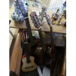 An Encore acoustic guitar, together with Robert Kaye Kneller acoustic guitar and two others.