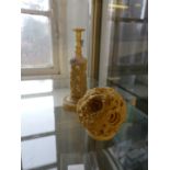A Chinese carved ivory puzzle ball and stand,