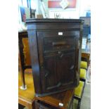 A good quality Jacobean style flat front corner cupboard,