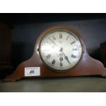 An Edwardian mahogany domed top clock with face bearing retailers marks for Russells & Co Ltd,