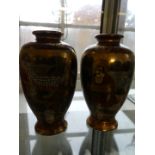 A pair of 20th Century Japanese satsuma vases of baluster form.