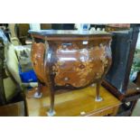 A reproduction Italian inlaid style bomb chest of three drawers.