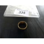 A 22K gold band, with engraved and pierced foliate designs, stamped 22K, approximate weight 3g.