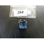 A blue paste cocktail ring, to precious yellow metal shank, gross weight approx. 8.