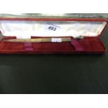 A contemporary Birmingham hallmarked silver paper knife in fitted plush lined case.