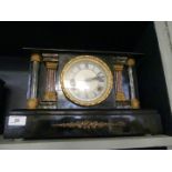 A late Victorian mantel clock in architectural ebonised and marble effect case,
