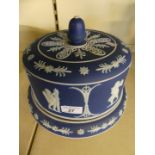 A large blue and white Jasperware cheese stand and cover, decorated with cherubs, 26.