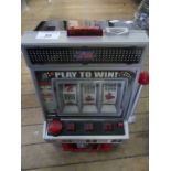 A contemporary Las Vegas battery operated one arm bandit fruit machine,