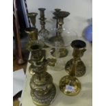 A mixed lot of eight assorted late 19th/early 20th Century continental brass candlesticks,