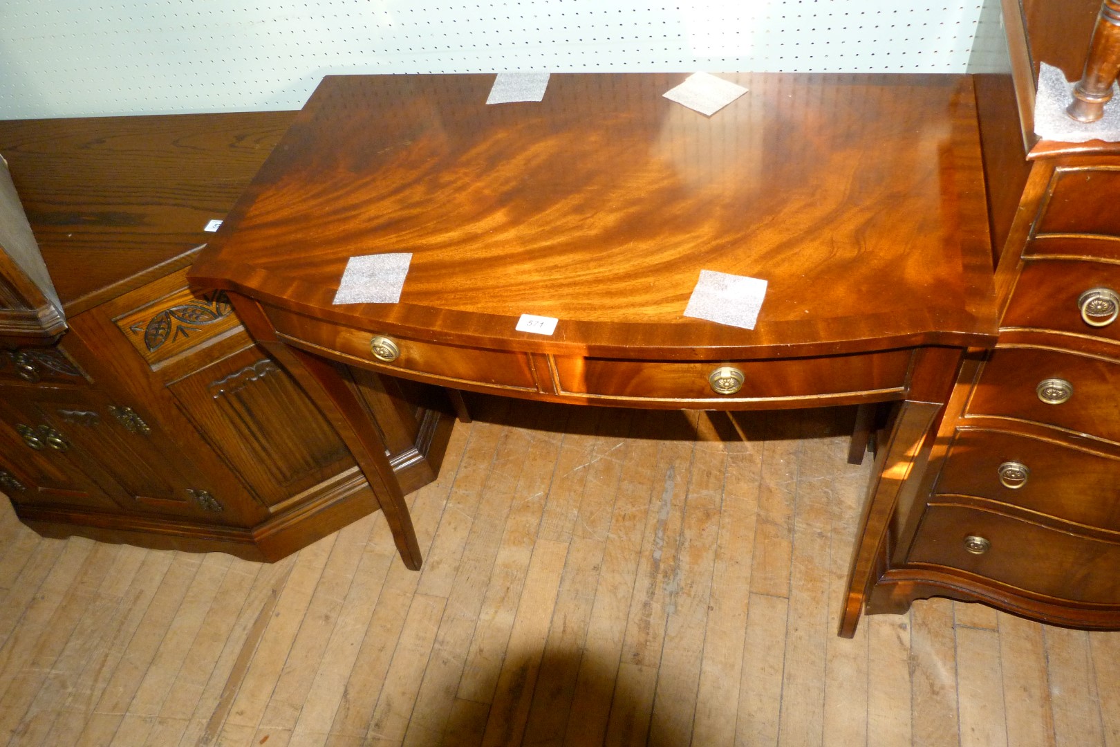 A good quality Reprodux Bevan Funnel mahogany side table, having two single drawers.