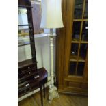 A white painted Marie Antoinette style standard lamp.