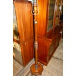 An early 20th Century mahogany standard lamp. (sold electrically untested).