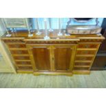 A good quality reproduction mahogany crossbanded breakfront sideboard,