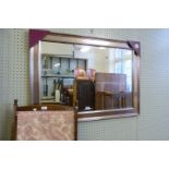 A good quality modern silver framed bevelled edged wall mirror.