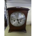 An early 20th Century mahogany cased mantel clock, with brass movement, striking on a gong.