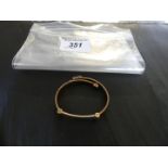 A 9k tri-coloured gold bangle, weight approx. 13.