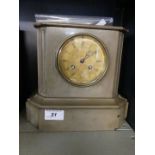 A Victorian grey slate mantel clock, complete with key and pendulum.