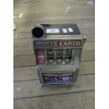 A contemporary Monte Carlo battery operated one arm bandit fruit machine,