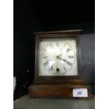 A Georgian style mahogany cased bracket clock with silvered dial, the movement marked W & H.
