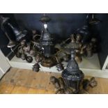 A set of four 20th Century hanging ceiling light fittings with bronzed and painted finishes