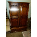 A good quality Titchmarsh & Goodwin style solid oak wardrobe, having twin panelled doors,