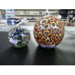 Two 20th Century coloured glass paperweights, both unsigned, largest 9cm high.