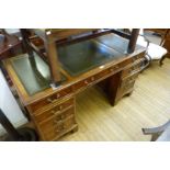 A good quality reproduction mahogany flat top kneehole desk,