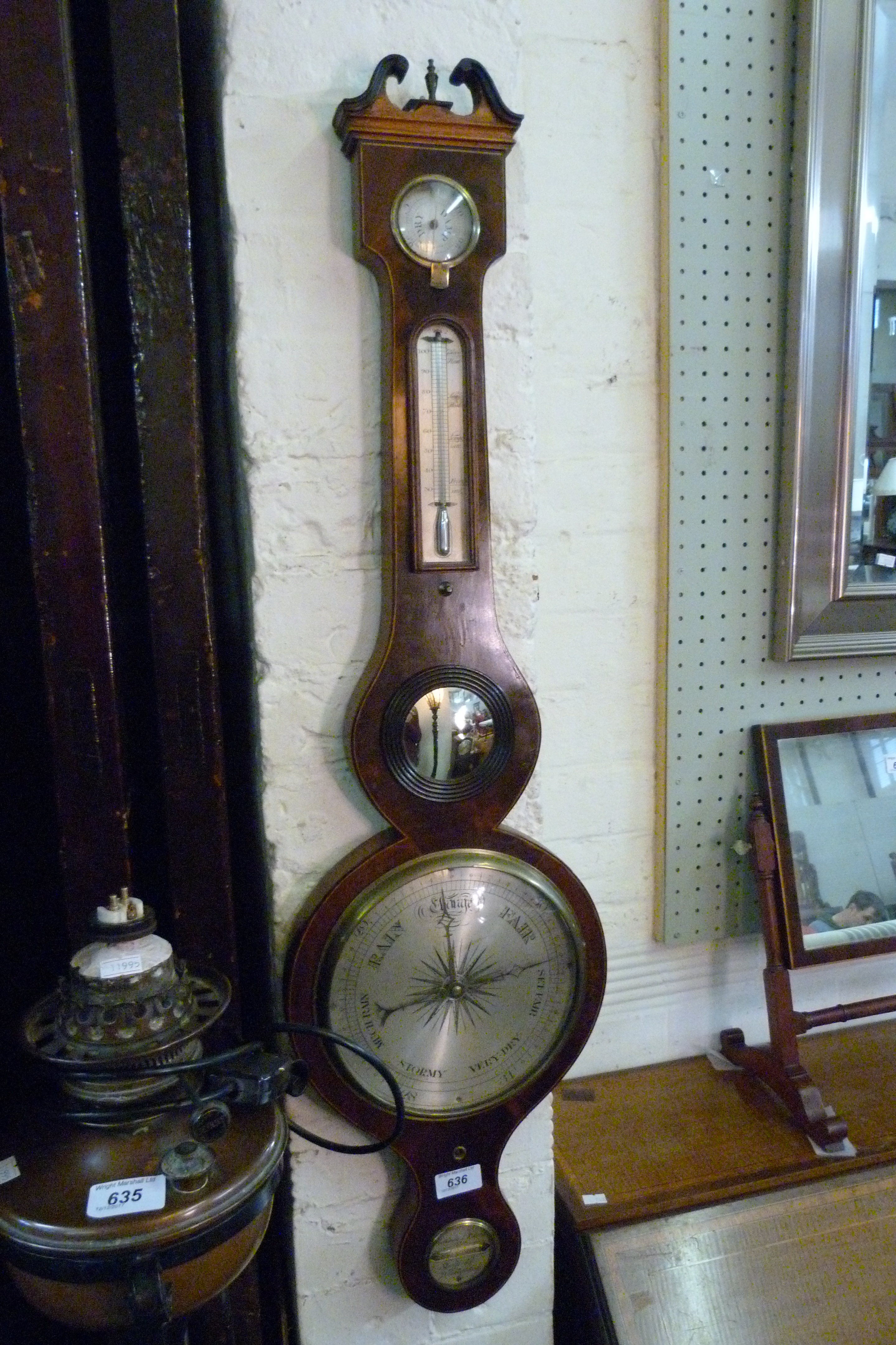 A Georgian mahogany wheel barometer.