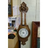 An early 20th Century oak banjo barometer.