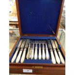 A cased canteen of mother of pearl handled desert knives and forks