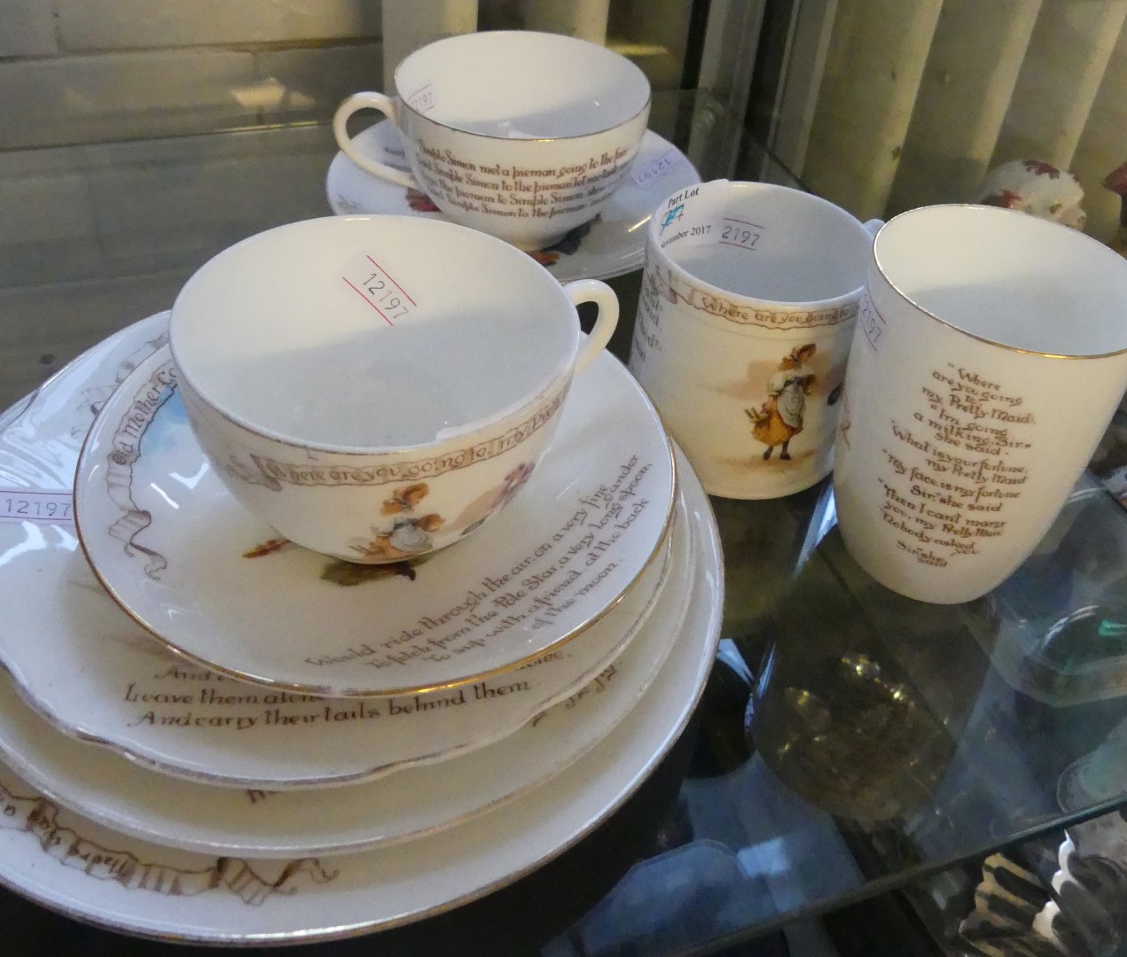 A collection of Royal Doulton nursery rhymes tablewares comprising two cups and saucers,