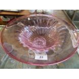 A modern cranberry and clear glass pedestal tazza