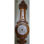 Late 19th/early 20th Century carved oak barometer/thermometer combination