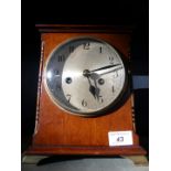 An early 20th Century mahogany cased mantel clock, with brass movement, striking on a gong.