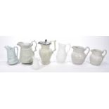 A collection of 19th century and later relief moulded jugs To include an example by Jones & Walley