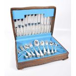 An oak cased canteen of cutlery Comprising setting for six EPNS shell and thread pattern flatware.