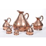 A matched set of 19th century copper measures To include quarter pint, half pint, pint,