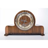 A walnut veneered Art Deco mantle clock, early 20th century 13cm silvered dial with Roman numerals,