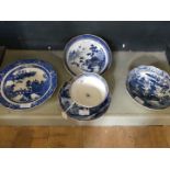 Five pieces of 18th Century blue and white pearl ware, each decorated with Chinese landscape scenes,