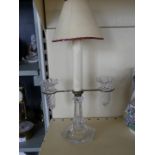 A Baccarat clear glass twin branch candle holder,