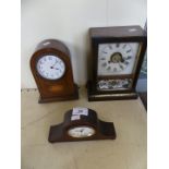 A mixed lot of three early 20th Century mantel clocks to include an example with inlaid detail.