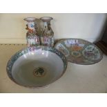 Four pieces of Cantonware, to include two twin handled vases, circular plate and bowl.