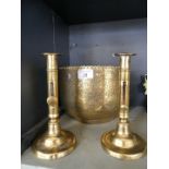 A pair of 19th Century brass ejector candlesticks and an Indian brass bowl.