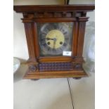 An early 20th Century mantel clock in architectural carved case.