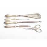 A silver handled manicure set