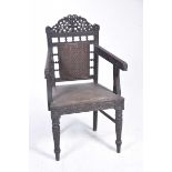 An Indian hardwood elbow chair, possibly