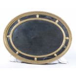 An early 20th Century oval giltwood mirr