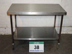 A 1100mm x 650mm Stainless Steel Mobile Preparation Trolley on Castors