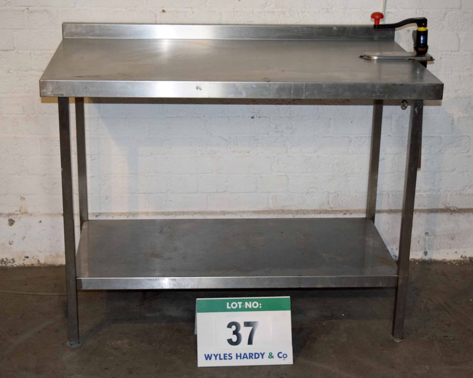 A 1200mm x 700mm Stainless Steel Preparation Table with fitted BONZER Manual Tin Opener