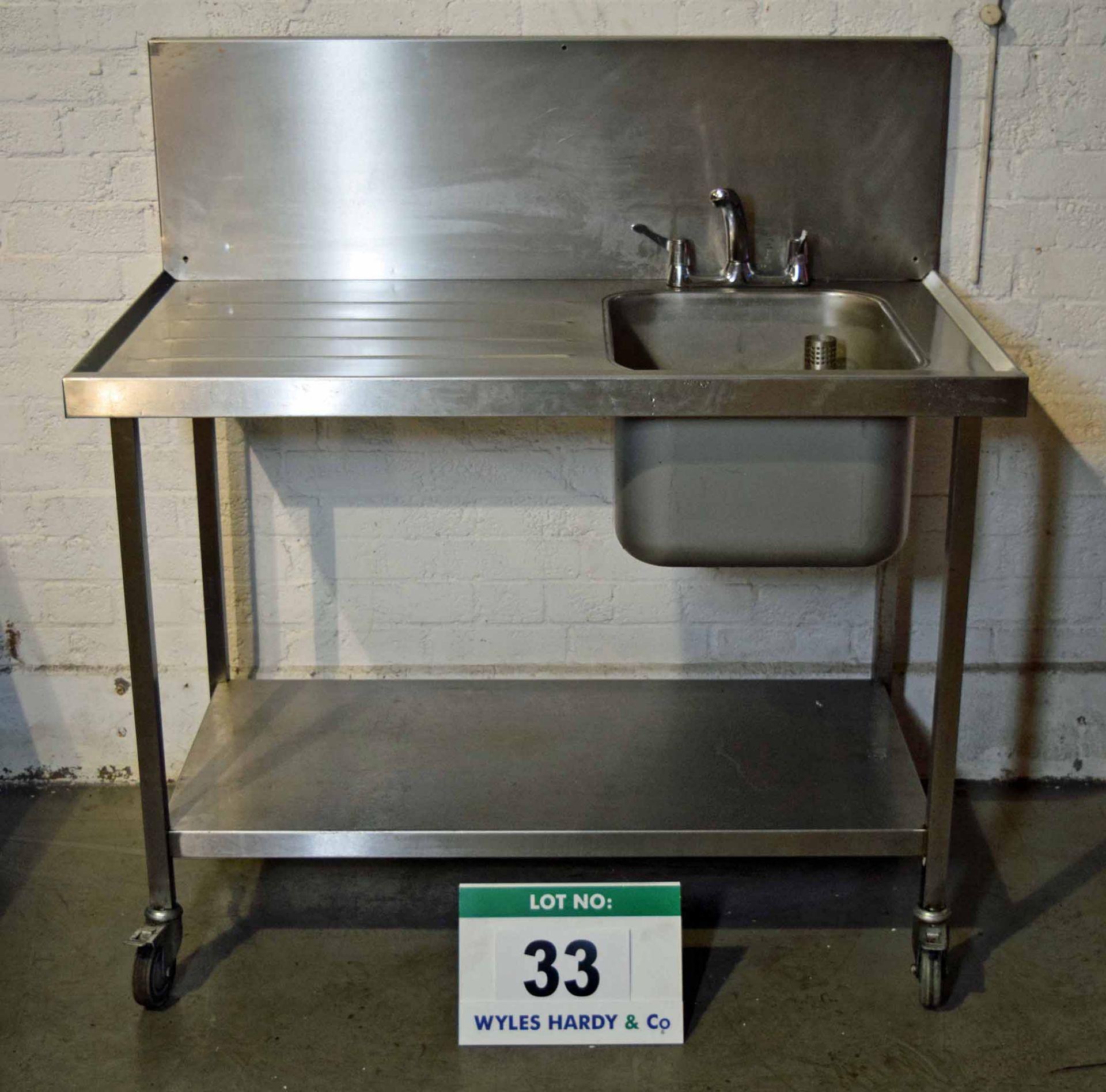 A 1200mm Stainless Steel Single Bowl, Single Drainer Kitchen Sink on Castor Wheels, fitted Mixer Tap